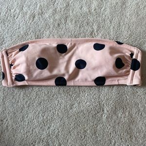 polka doted pink strapless swimsuit